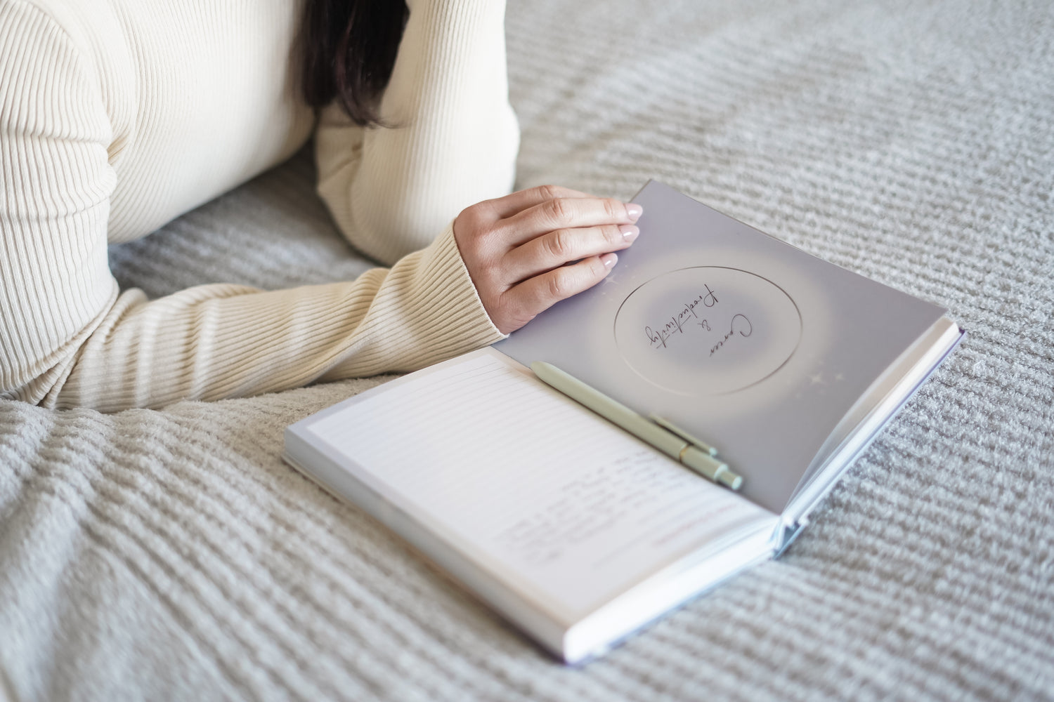 A person journaling with the 365 intention journal